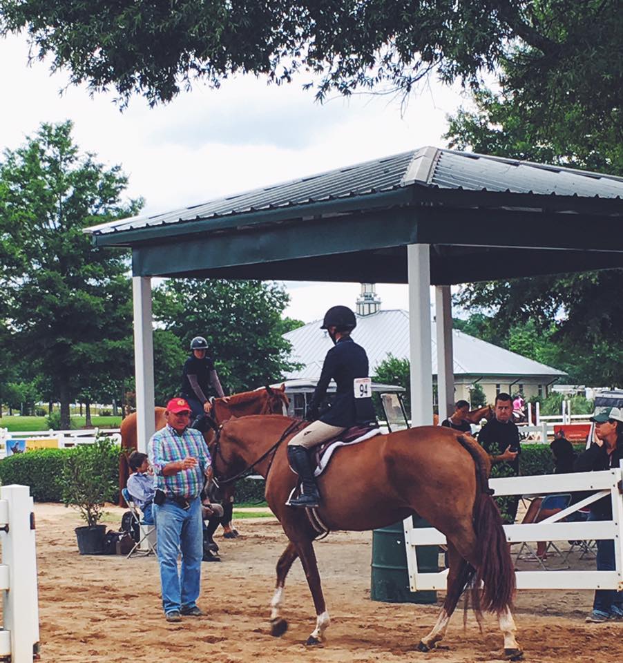 Trainer Jack Towell congratulates Maraschino and Lily Bennett after one of their winning performances in Atlanta.