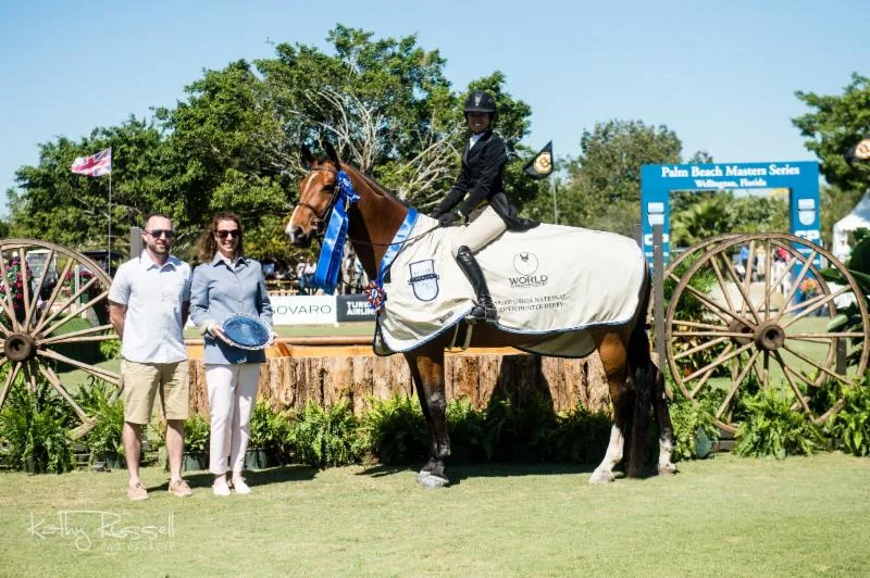 Clemens, owned by Finally Farm and Westerly Farm, receives his awards with Liza Boyd