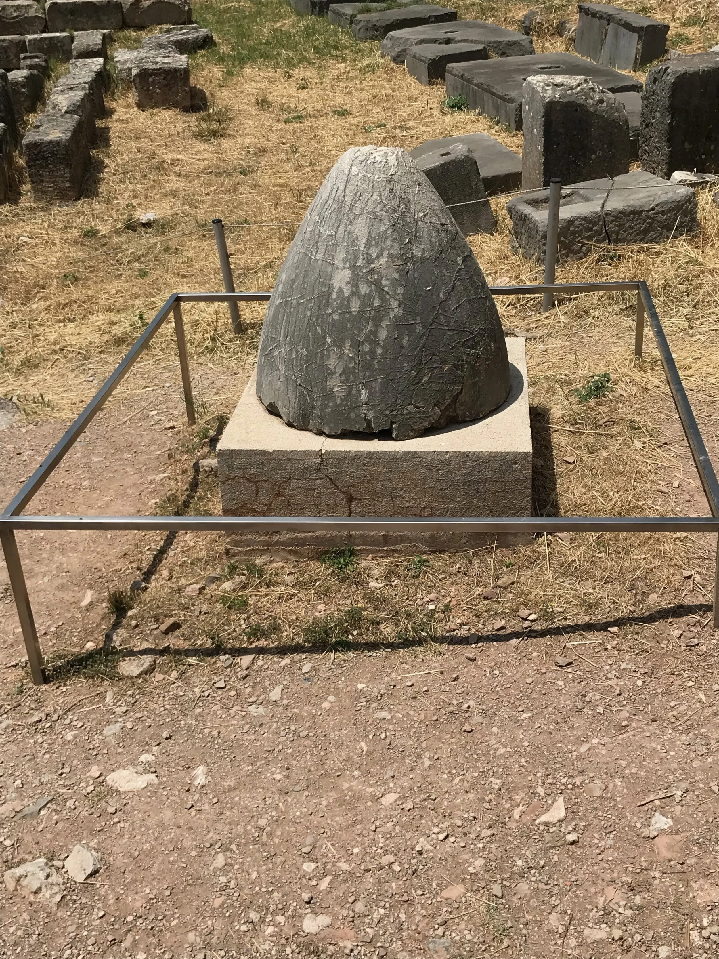 The Sacred Omphalos, The Navel of the Earth. According to ancient Greek myths, Zeus sent out two eagle from the opposite ends of the earth and where they met, at this site, was thought to be the navel or the entry point to other worlds. Our guide told us that this was also thought to be the place where Zeus killed a giant python or serpent.