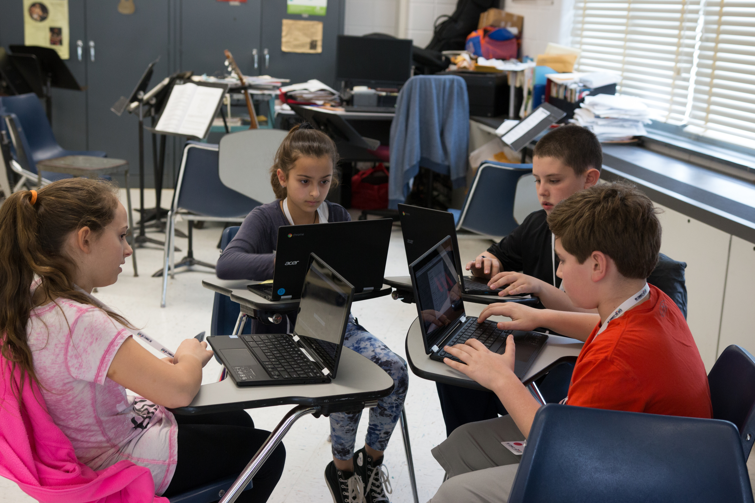 Getting down to business: students work together planning and developing their idea through brainstorming and autonomous research.