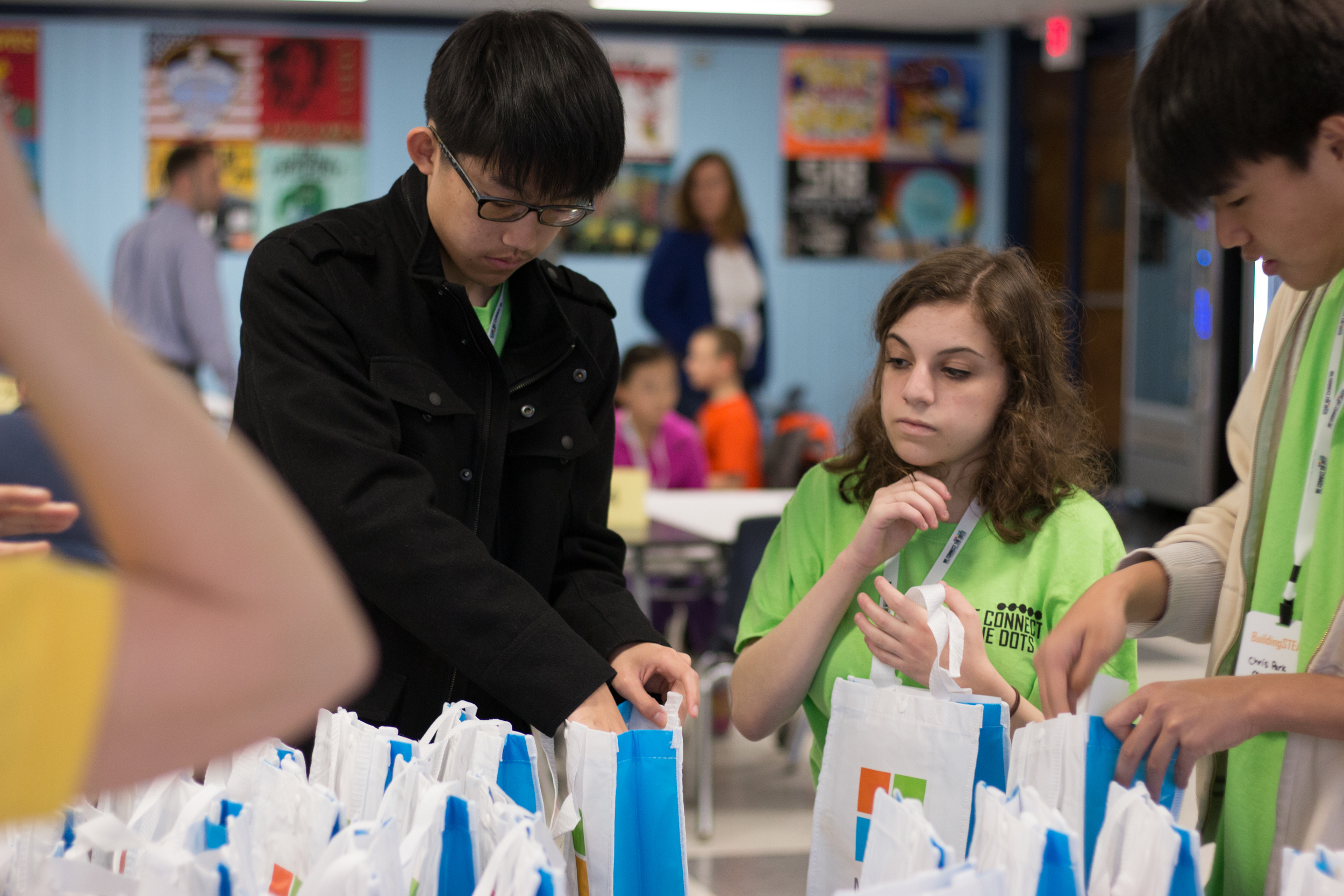 Student mentors from Plainview-Old Bethpage High School pack prize bags for participants. 