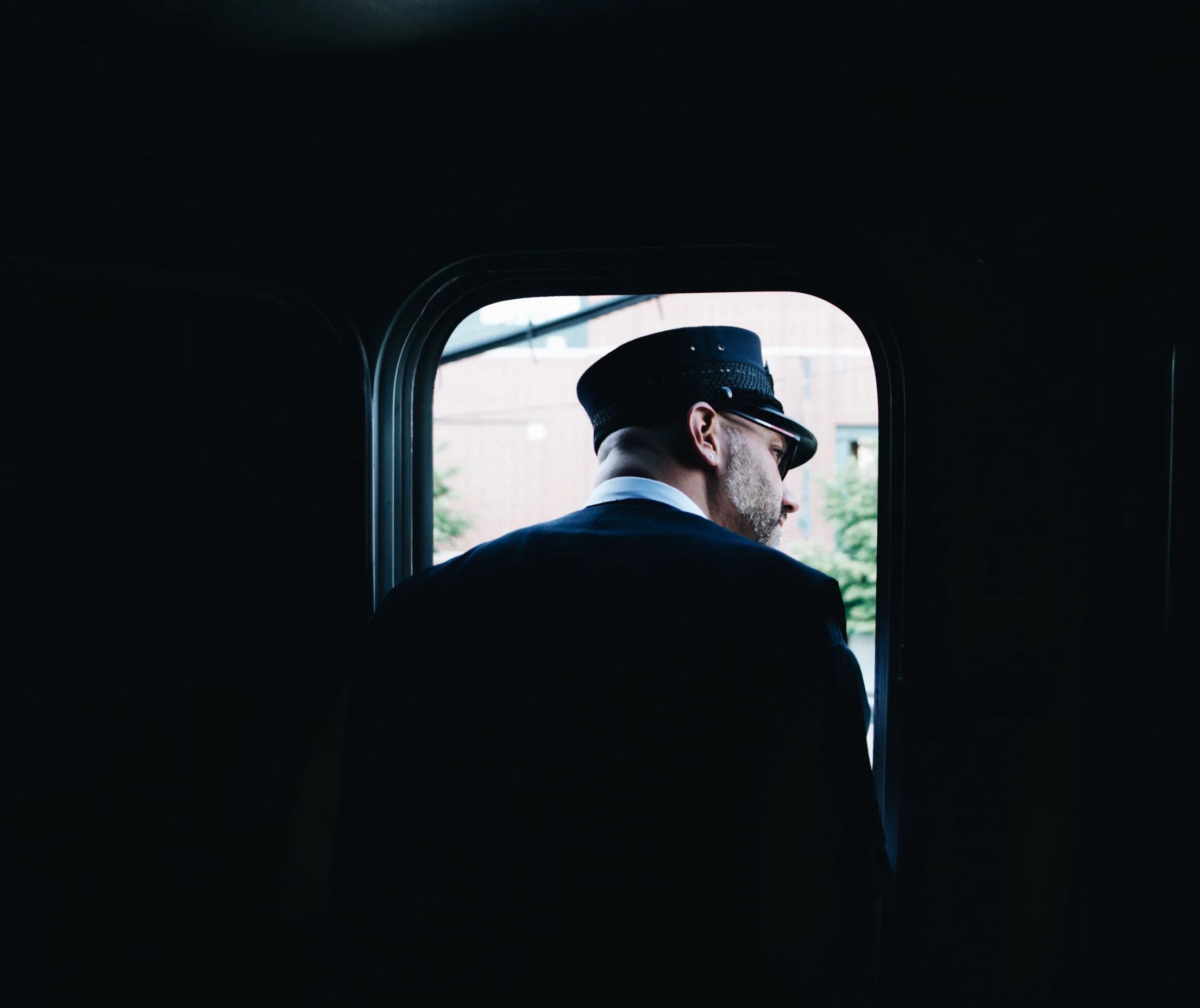 Conductor John looks down the platform as we depart Blumington-Normal, IL