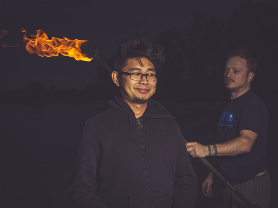 Brian de Rivera Simon with fire spinner and photographer, Andrew Miller