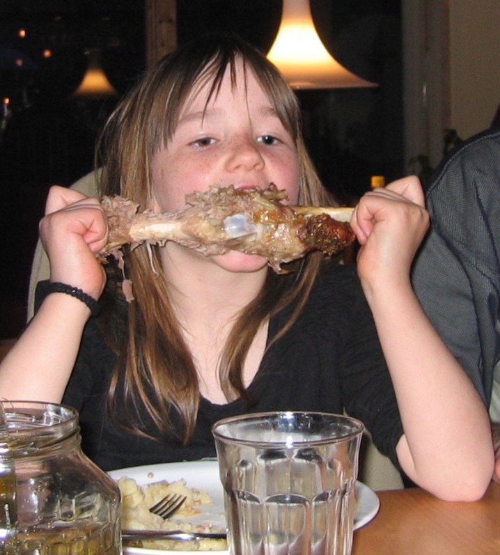 My beloved niece, eating a leg of lamb, 2004.