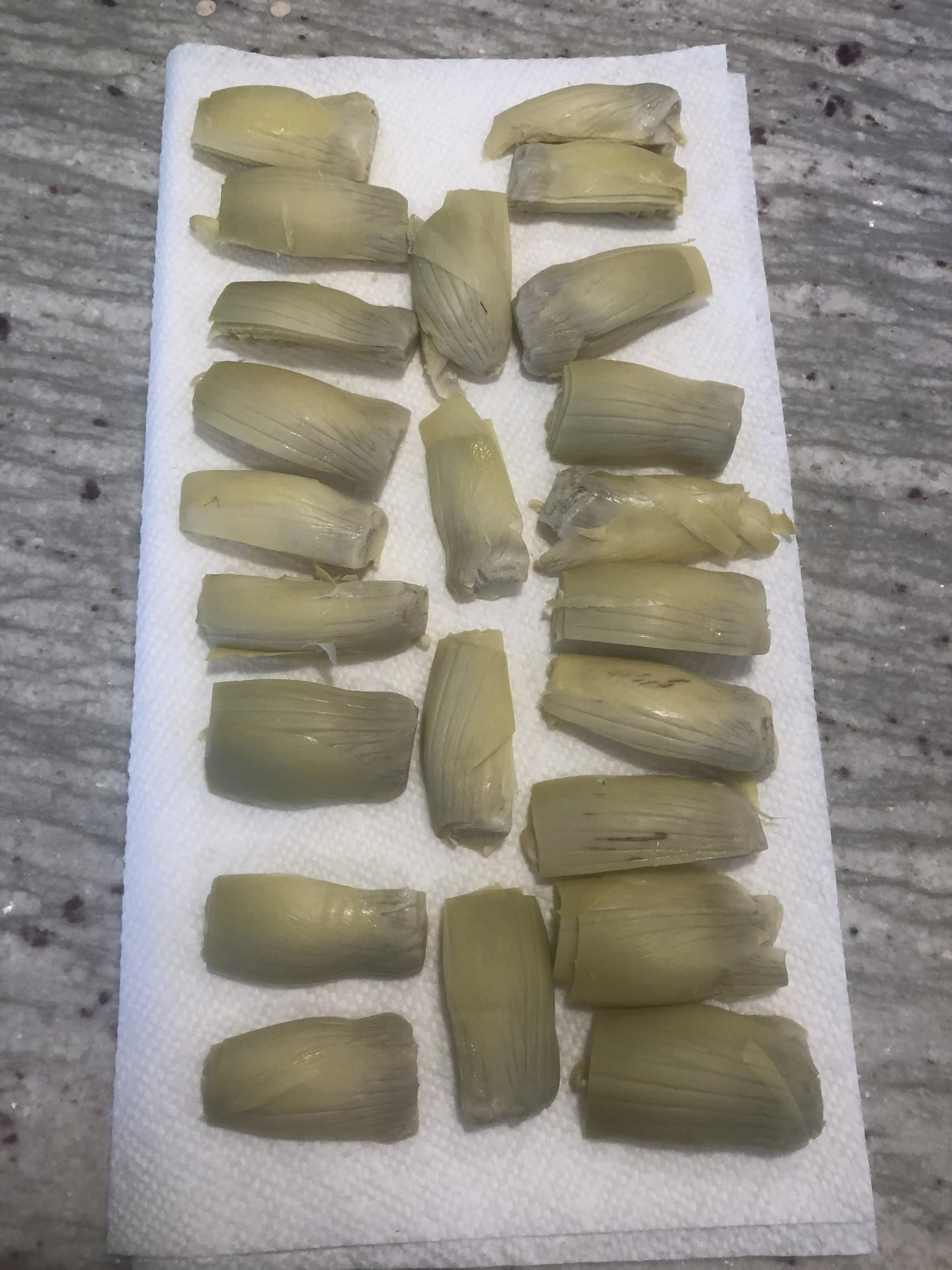 Draining the artichokes.