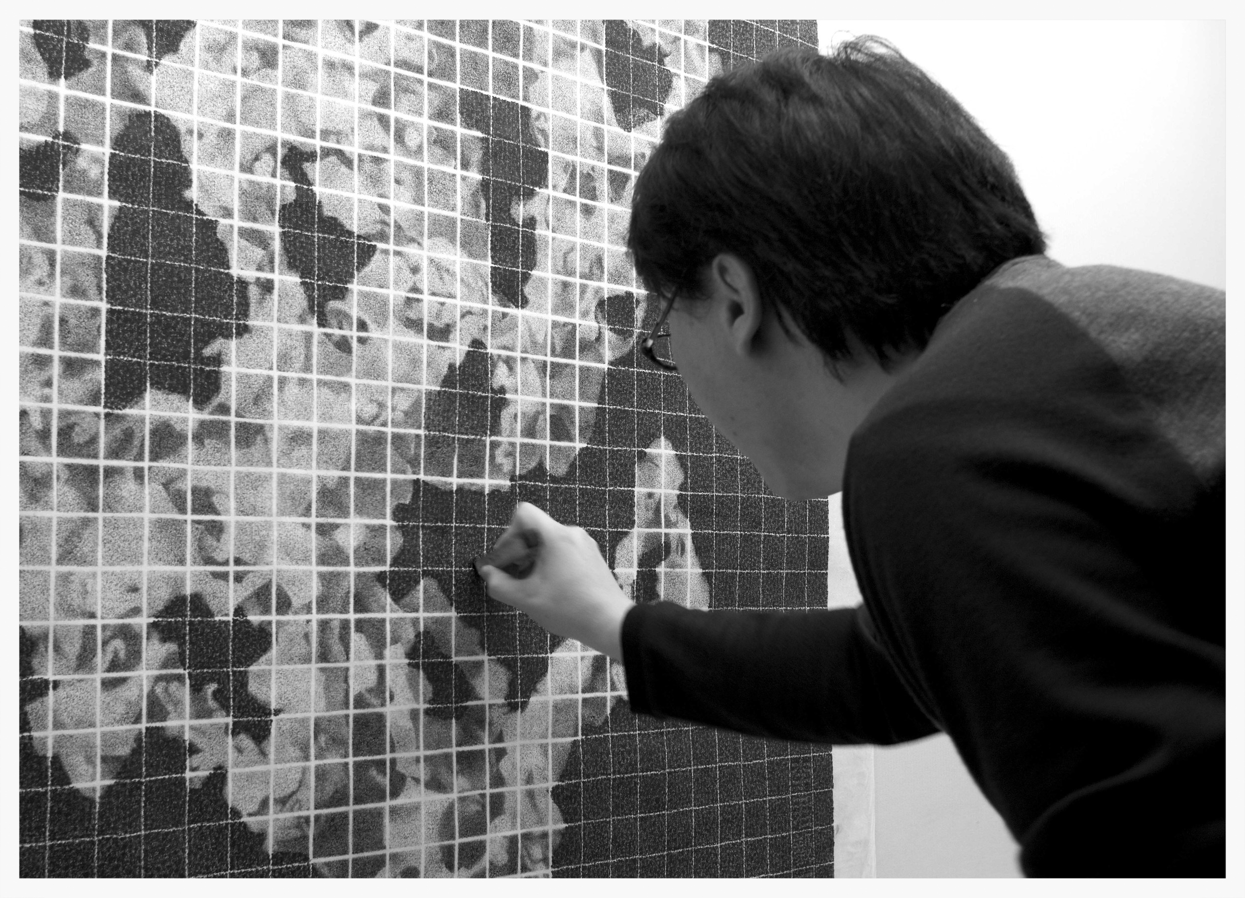 Lee Chun-Yi using his unique cork stamp to compose 'Association of Rock'.