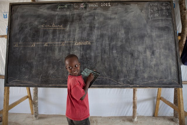 A child attending school in a refugee camp in Liberia. Half of the world’s child refugees are out of school. © Save the Children