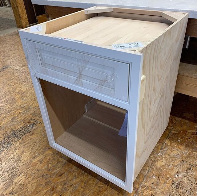 Time to catch up on posting projects! This was a cabinet we customized to have a roll-out cutting board over the roll-out garbage.