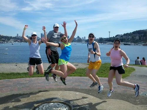 Look at the excitement of this group of coworkers is experiencing on a City Running Tours Seattle Running Tour . You can see the space needle in the background.
