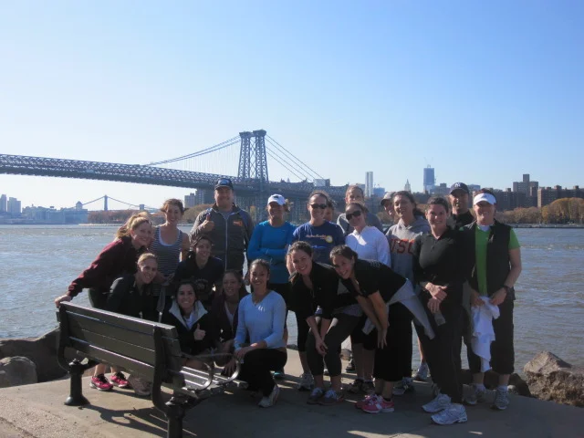 View of the Wiliamsburg Bridge and lower Manhattan on a running tour along the East River in Brooklyn.