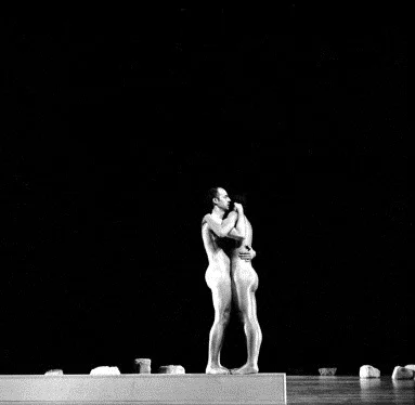 Artists Robert Morris and Yvonne Rainer perform together on stage at the Albright-Knox Gallery during the Buffalo Festival of the Arts Today, 1965.