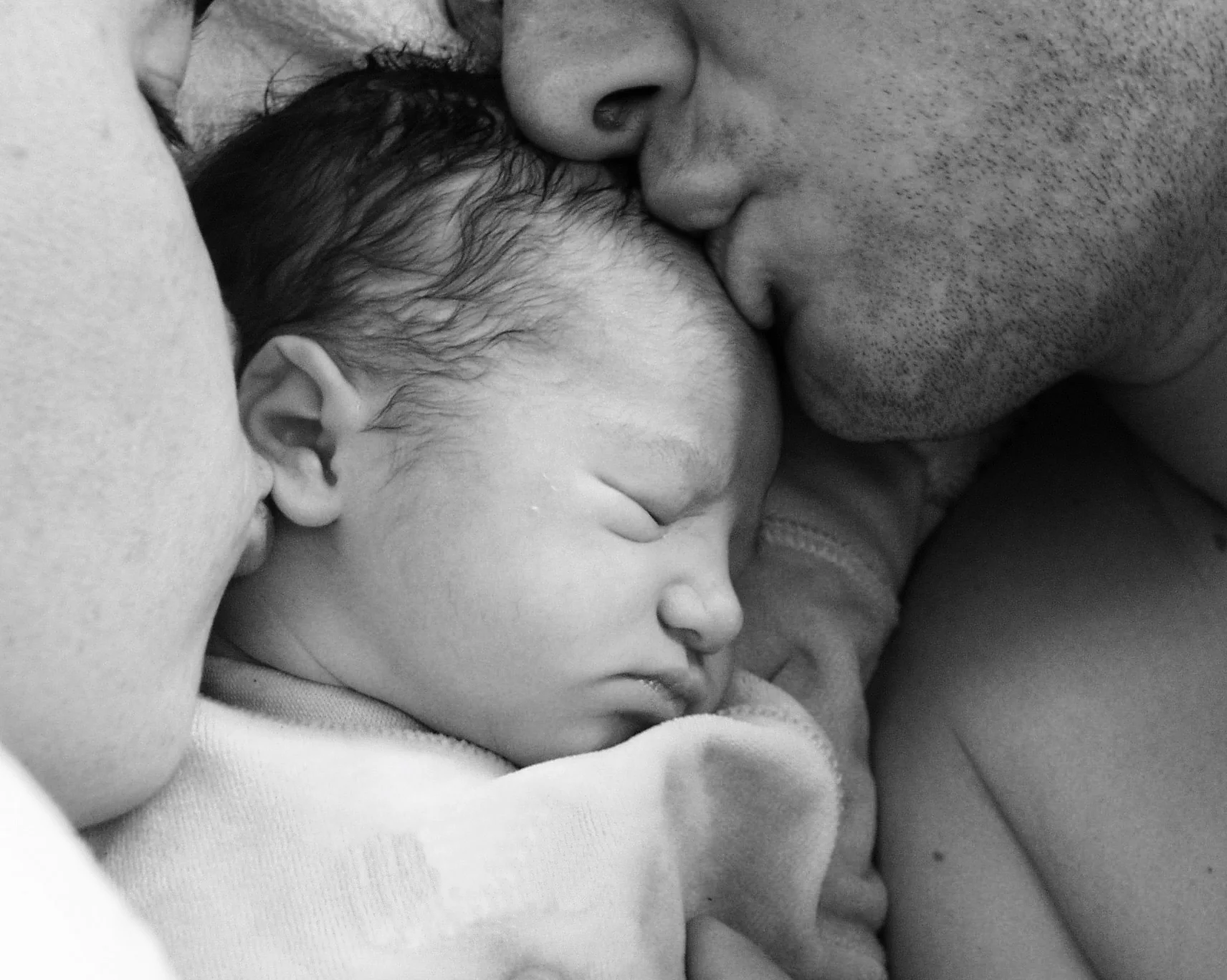 baby with parents.jpg