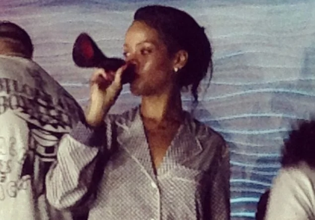 Rihanna sips stiletto 1.jpg