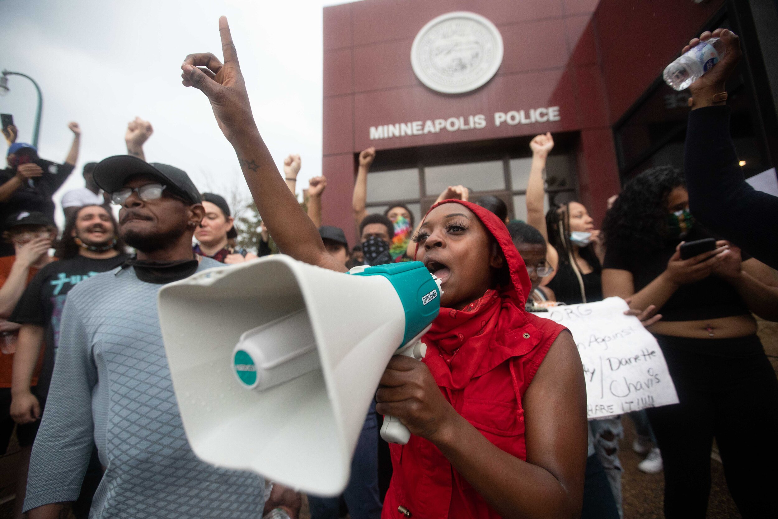  Speaking to the crowd, a protester talks in front of the Minneapolis 3rd police precinct during a protest over the police killing of George Floyd in Minneapolis, Minnesota on May 26, 2020. 