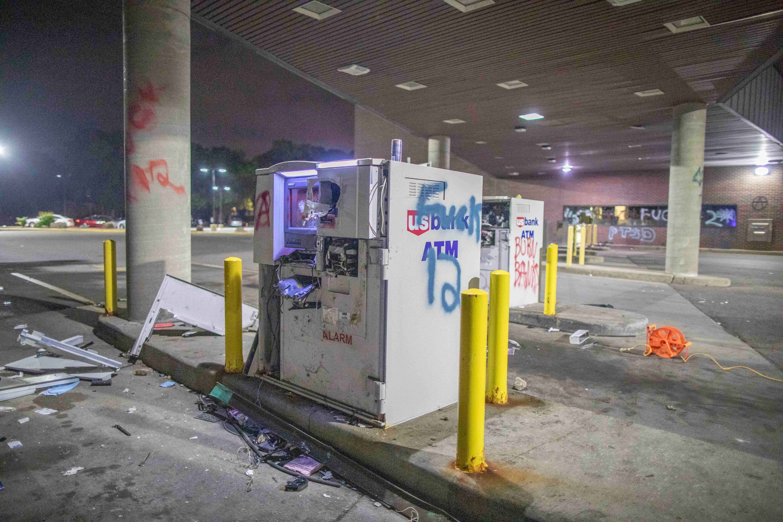  Drive thru ATM's sit torn apart at a US Bank drive thru location in Minneapolis, Minnesota after looters broke open the machines during a riot over the police killing of George Floyd. The windows into the bank were shattered as well as the the drive