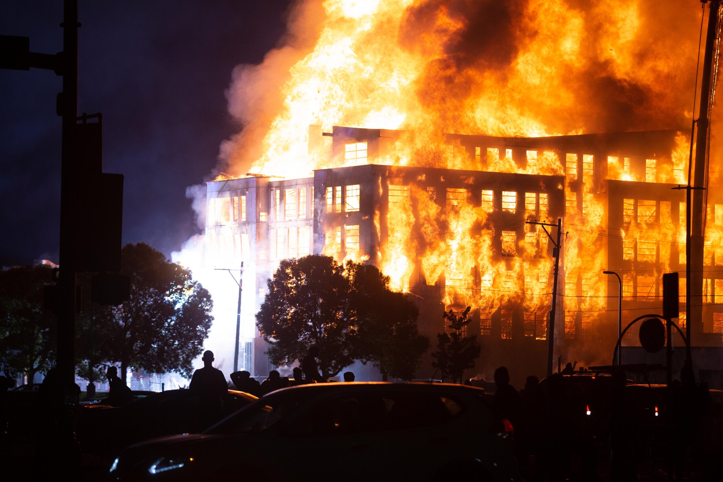  Transformers explode as a 190 unit affordable housing complex that was under construction burns after it was set on fire during a riot over the police killing of George Floyd in Minneapolis, Minnesota on May 28. 