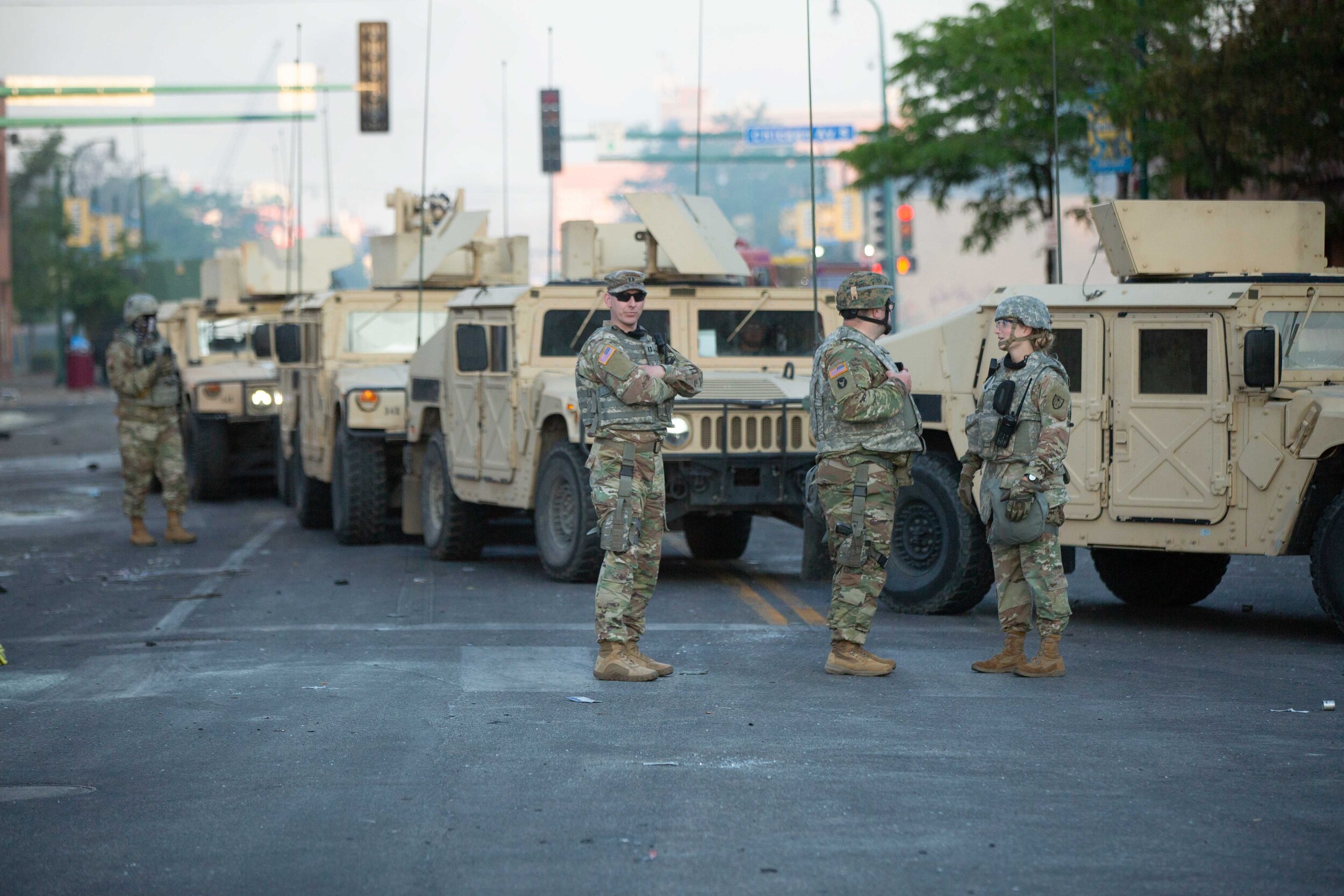  National guard solders stand on Lake Street in Minneapolis to secure the area after a night of rioting over the police killing of George Floyd on May 30, 2020. Chris Juhn/Zuma Press. 