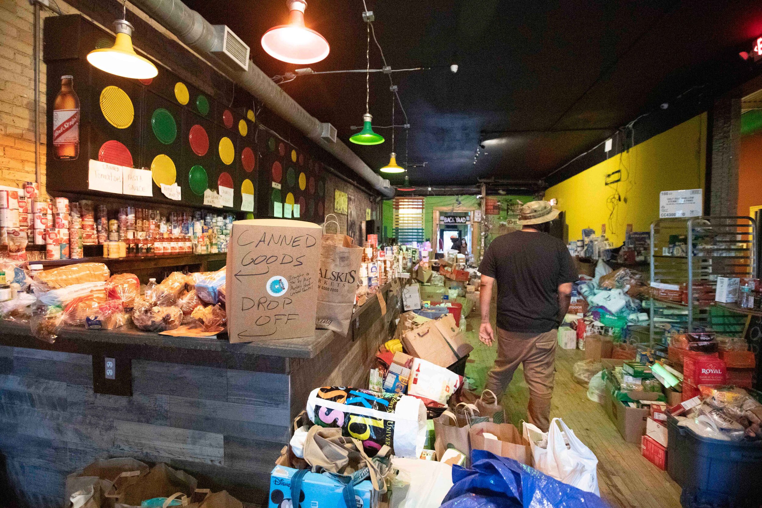  Food sits in the main seating area of Pimentos Jamaican Kitchen that was donated to be given away to people in need in Minneapolis, Minnesota on may 30, 2020, Chris Juhn/Zuma. 