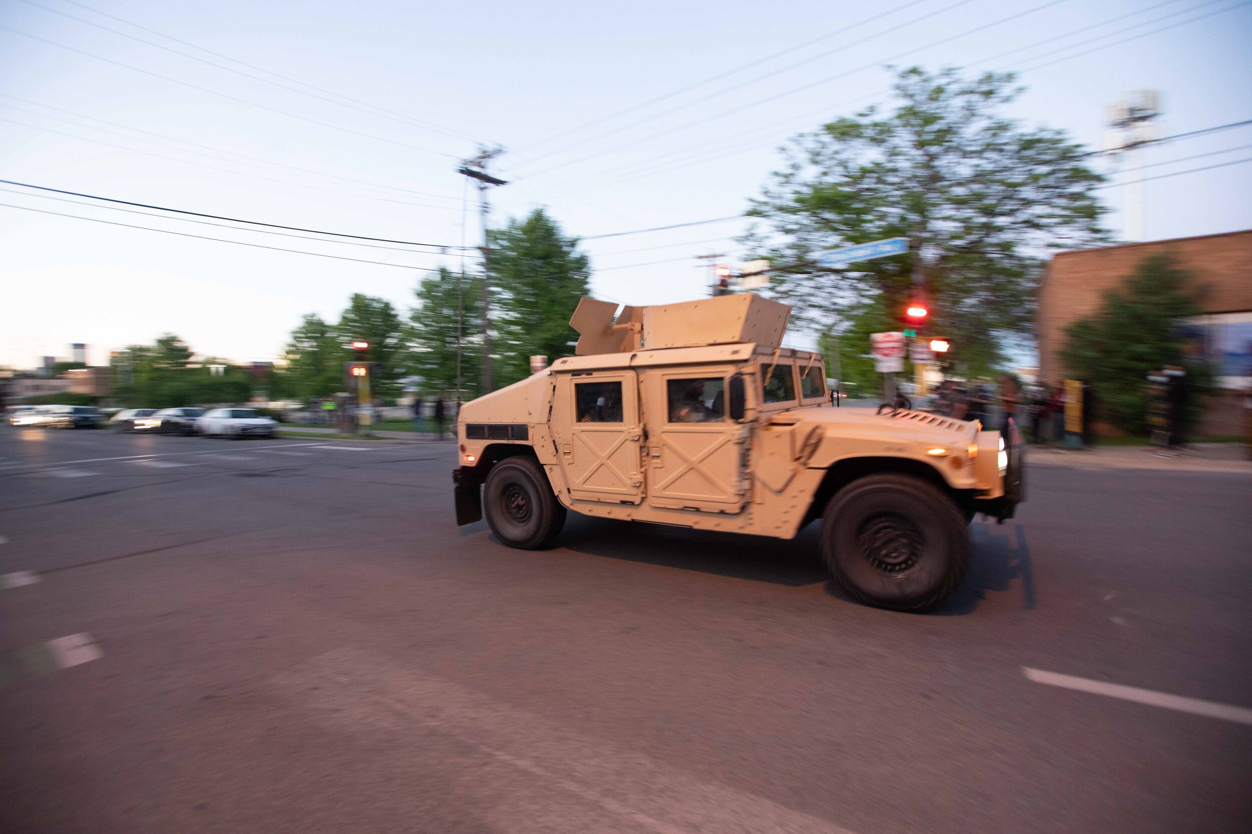  A humvee speeds down a street in Minneapolis where it was headed to help arrest protesters in Minneapolis, Minnesota on May 30, 2020. Chris Juhn/Zuma. 