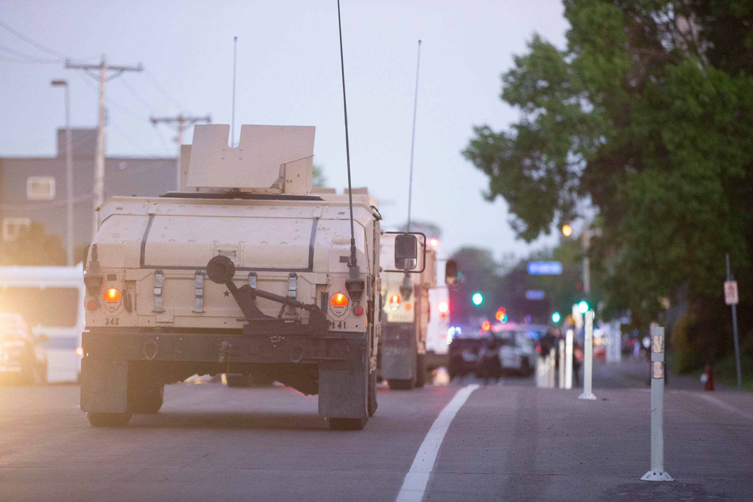  A caravan of humvees and military vehicles speed down a street in Minneapolis where it was headed to help arrest protesters in Minneapolis, Minnesota on May 30, 2020. Chris Juhn/Zuma. 