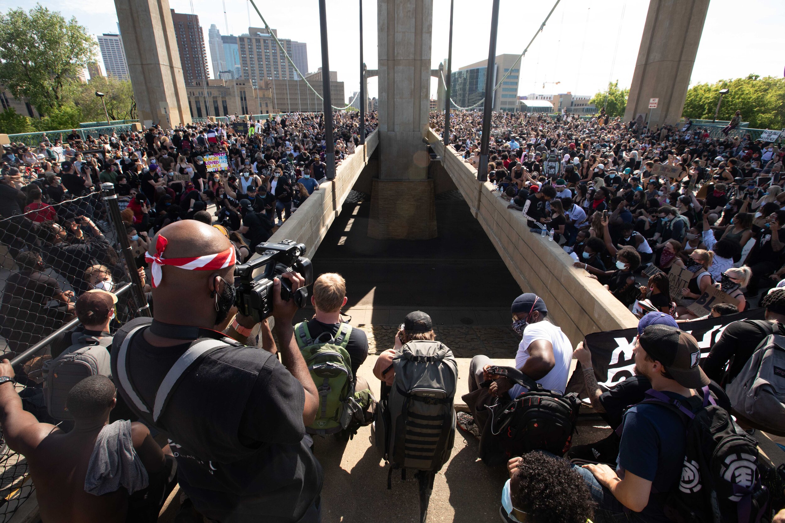  Over 20,000 protesters sat down in protest over the police killing of George Floyd on the Washington Ave bridge in Minneapolis on May 31. 