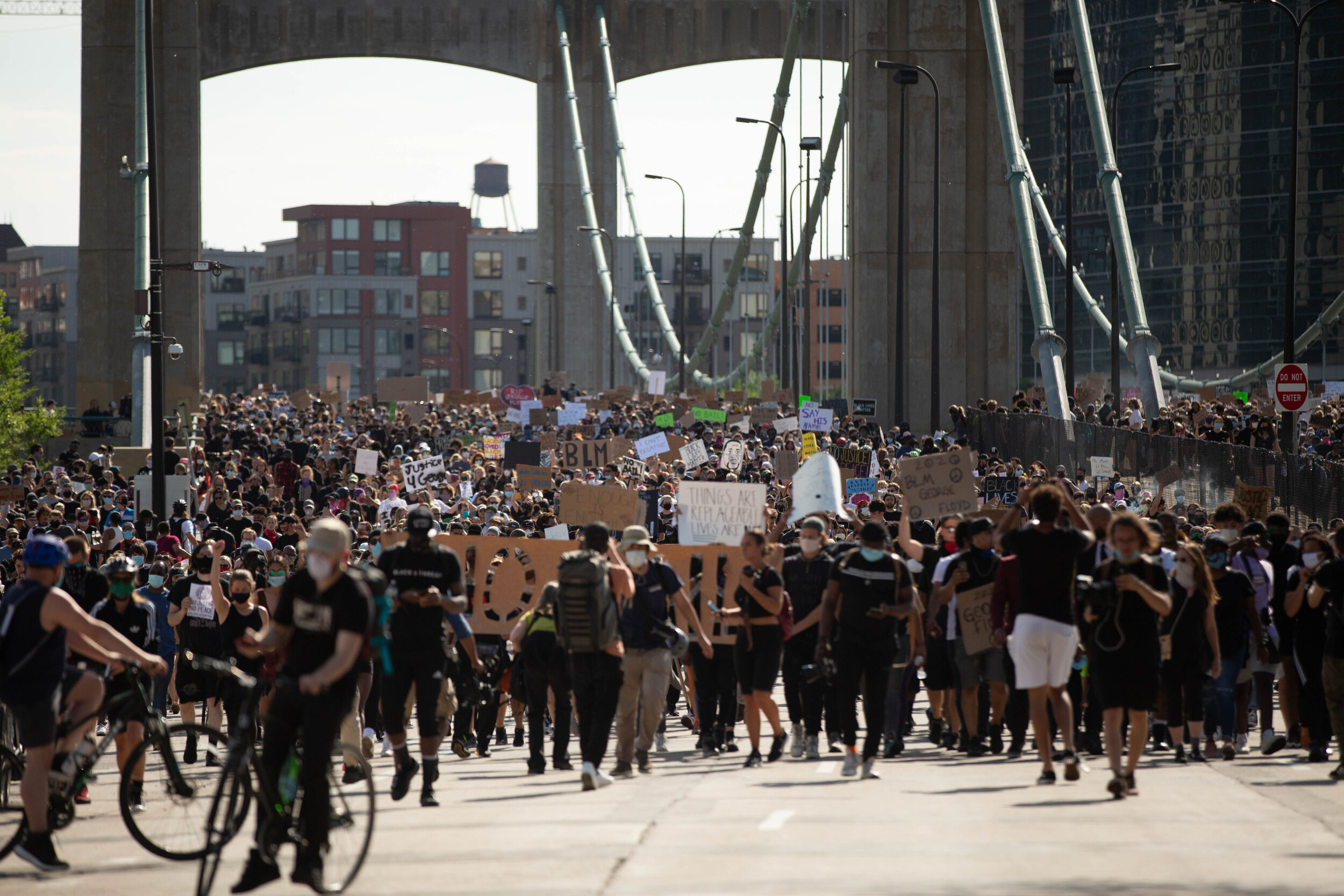  Protesters on the Washington Avenue Bridge in Minneapolis, Minnesota march off of it, eventually making their way to intersate 35W during a protest over the police killing of George Floyd in Minneapolis, Minnesota on May 31, 2020. Chris Juhn/Zenger 
