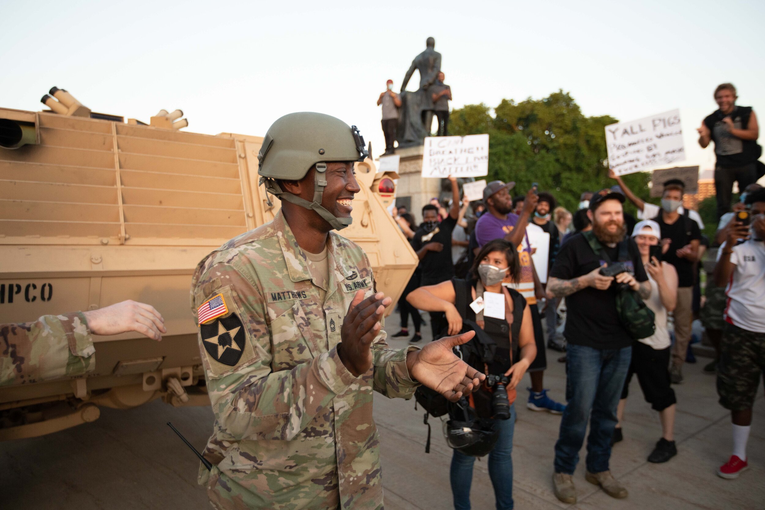  Master Sgt. Acie Matthews Jr., the Minnesota National Guard State Equal Opportunity Advisor claps as he goes to talk to protesters who were demonstrating over the police killing of George Floyd on the steps of the Minnesota State Capitol in Saint Pa