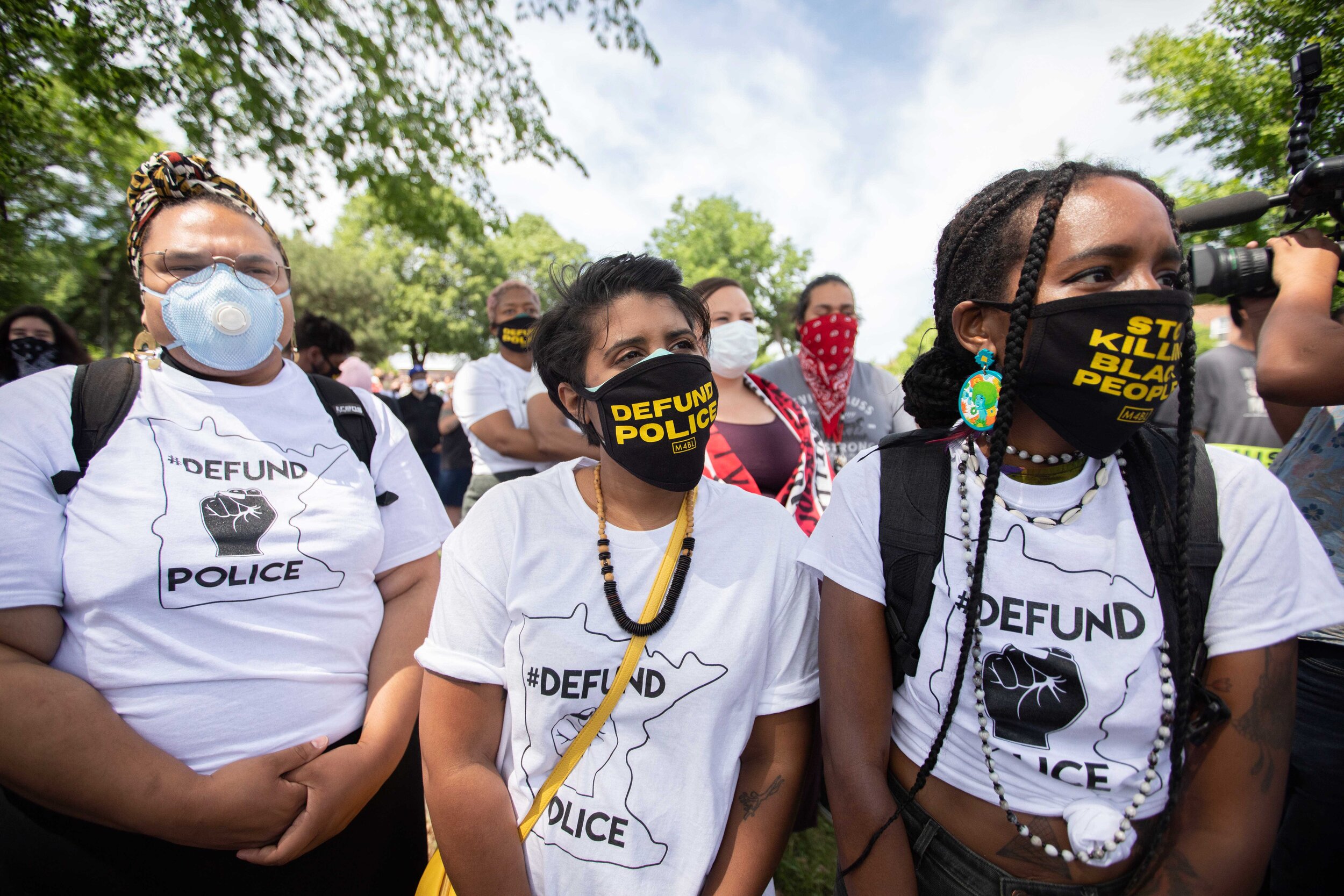  Protesters listen to speakers at a protest demanding the defunding of the Minneapolis Police Department at Bottineau Field in Minneapolis, Minnesota on Jun 6, 2020. 