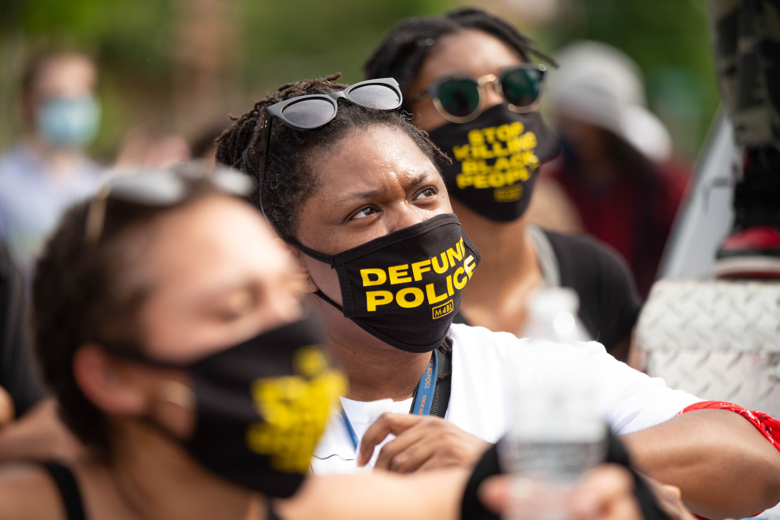  Protestres watch the New Black City Dance Group perfom during a protest to demand the defunding of the Minneapolis Police Department in Minneapolis, Minnesota on Jun 6, 2020. 