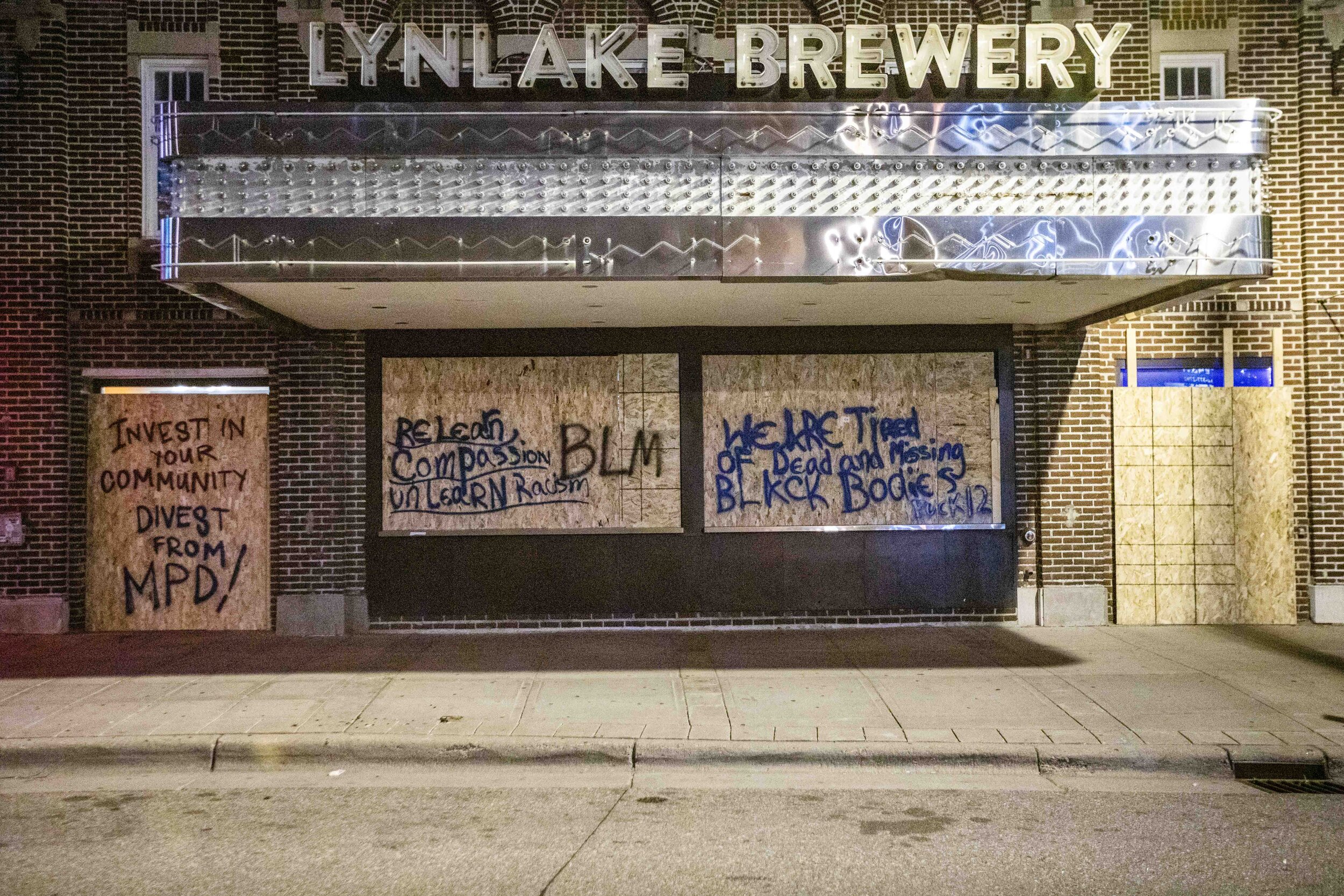  Graffiti is displayed on many of the buildings throughout Minneapolis and the Twin Cities. After looting broke out many businesses put boards up over windows in an attempt to keep their businesses from being looted and burned to the ground. Artists 