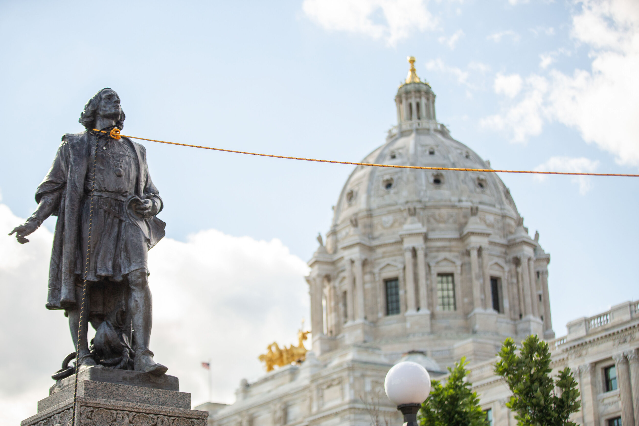  Native American activists sting up rope around the neck of the Christopher Columbus statue on the grounds of the State Capitol in Saint Paul, Minnesota on Jun 10, 2020. 