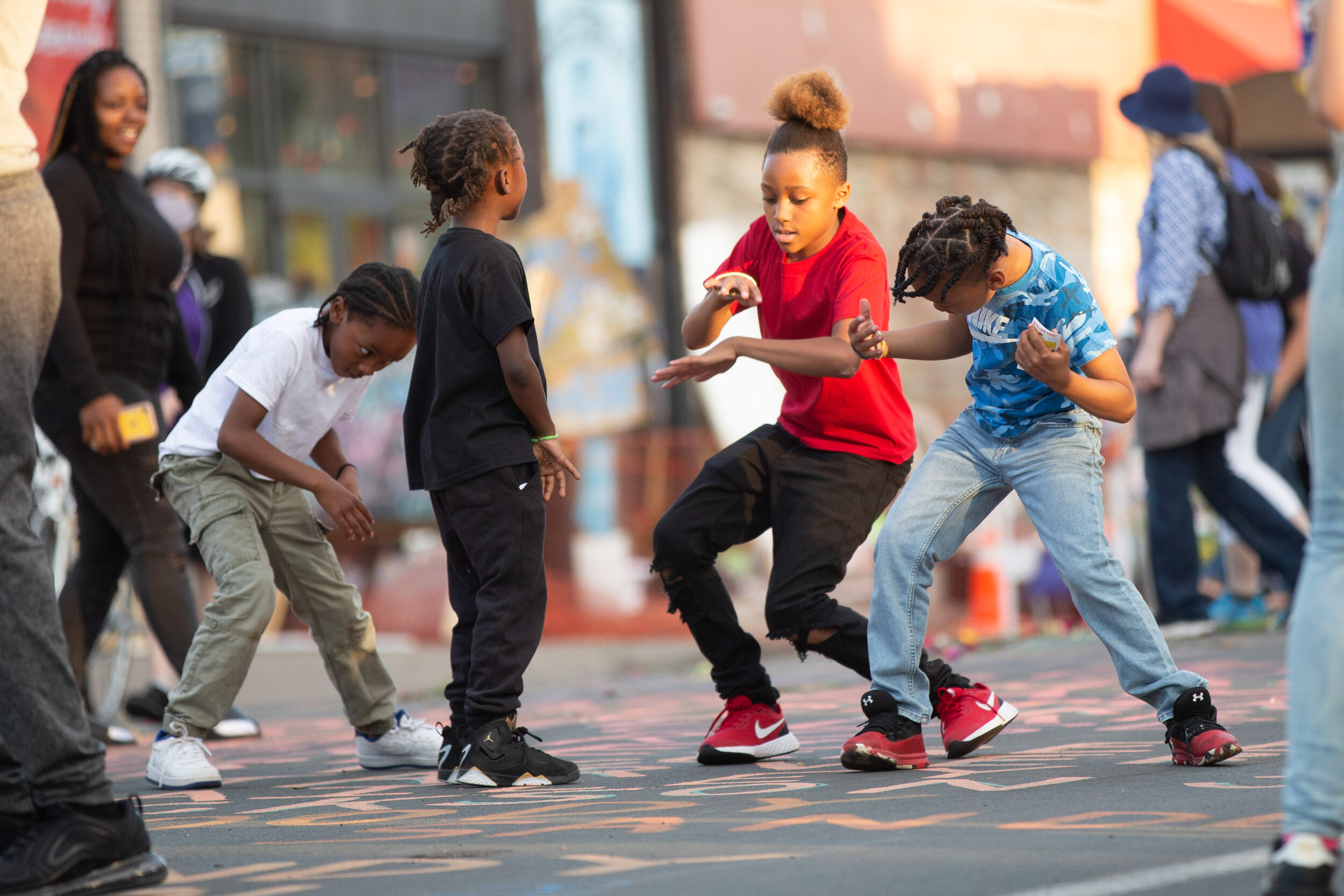  Children dance on the street at 38th and Chicago Ave at the memorial site for George Floyd who was killed by police on Jun 13, 2020 in Minneapolis, Minnesota. 
