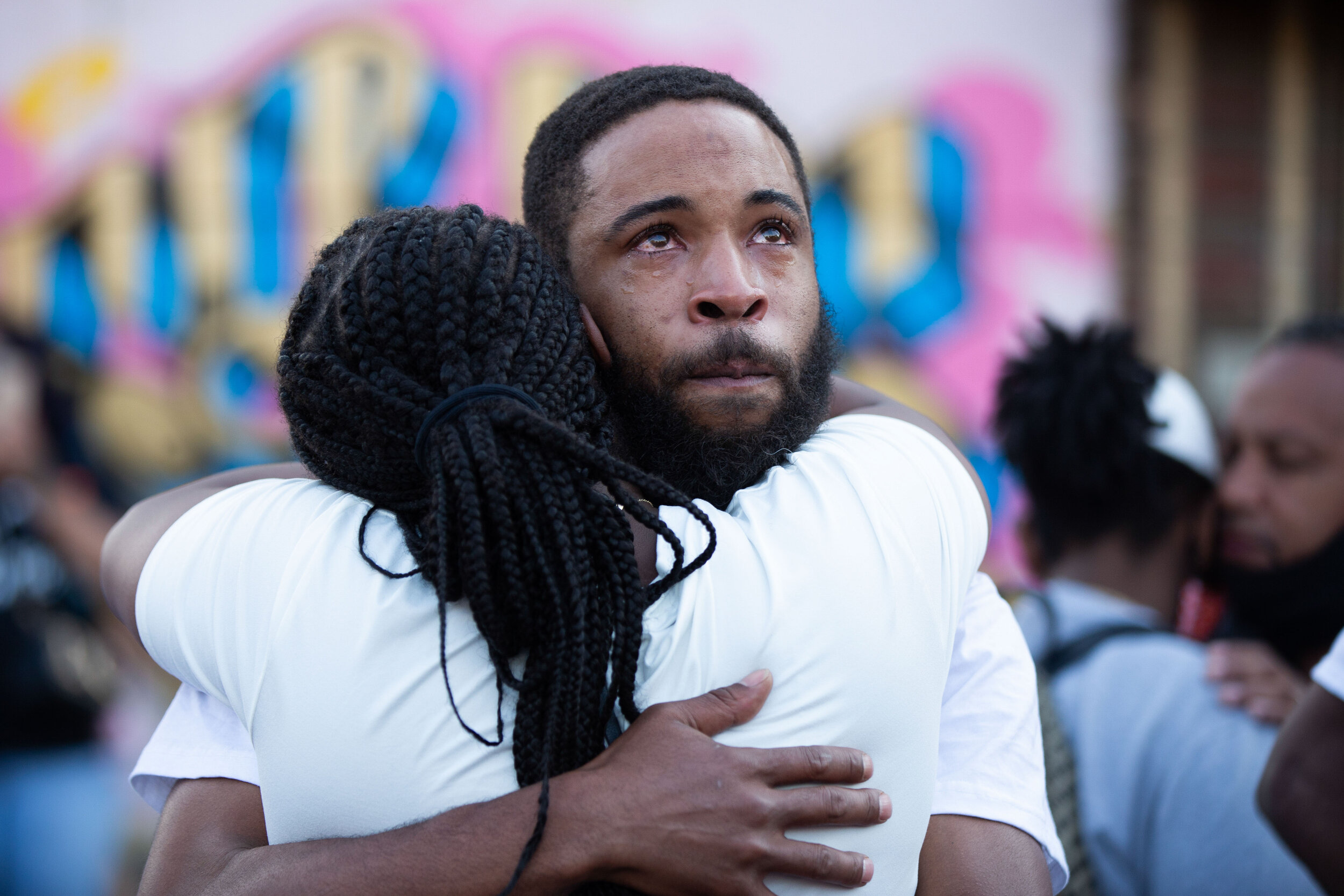  During a prayer session at the memorial site for George Floyd, a man tears up as people around him pray in Minneapolis, Minnesota on Jun 14, 2020. 