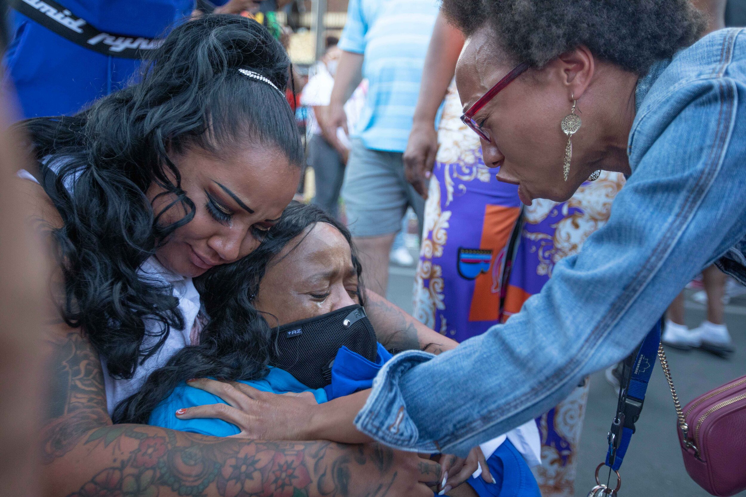  While doing a group prayer and being prayed over, a women breaks down in tears as multiple people pray over her at the George Floyd memorial site in Minneapolis, Minnesota on Jun 14, 2020. 