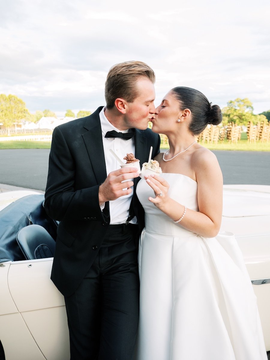 Bride and groom sharing icecream at wedding reception