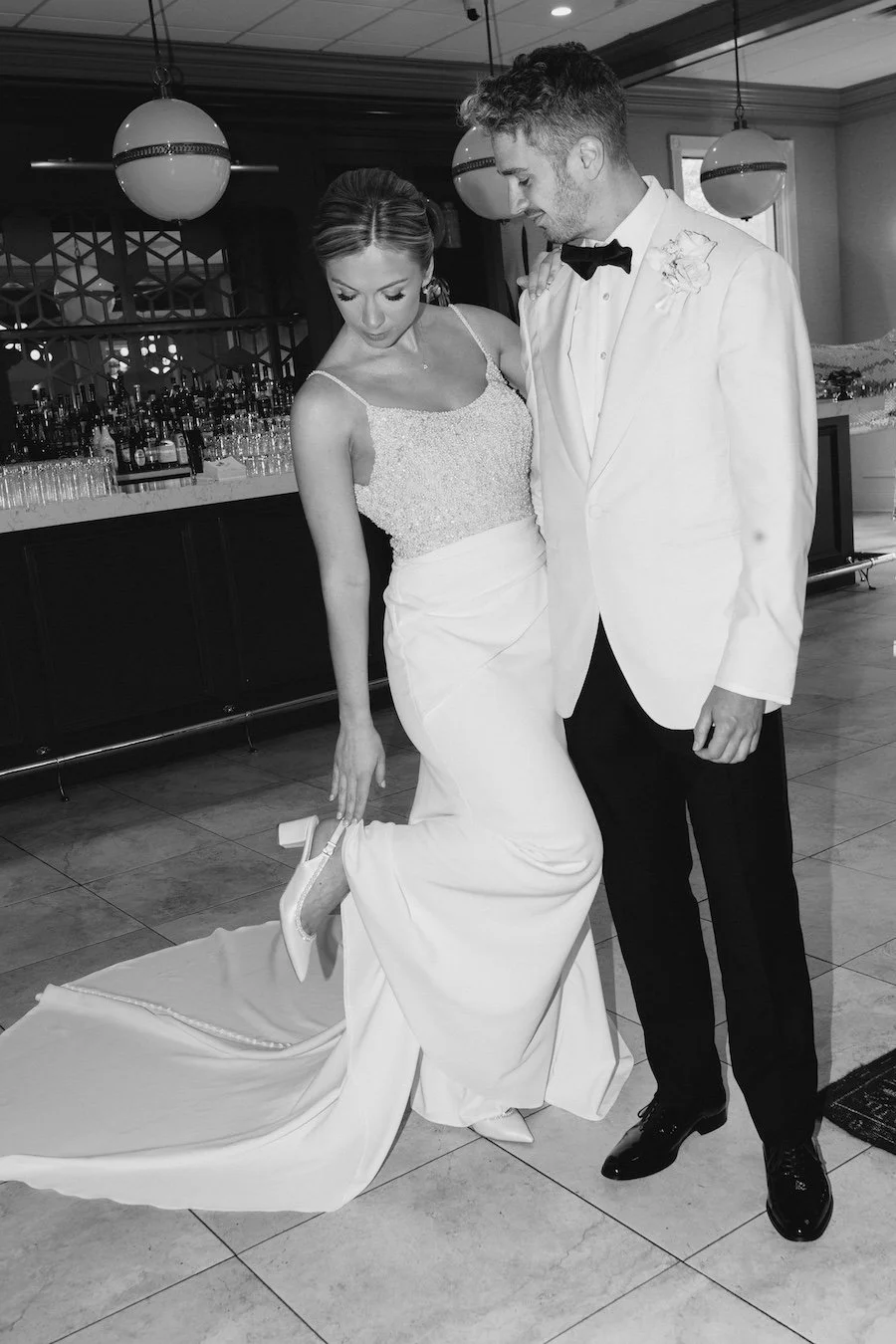 Vintage style black and white flash classic candid photo of bride and groom at Farmington Polo Club wedding