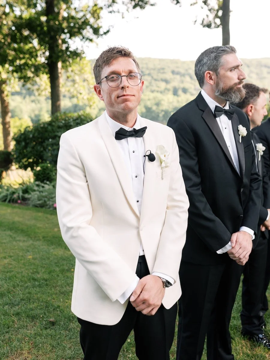 Photo of the groom waiting for bride walking down the aisle