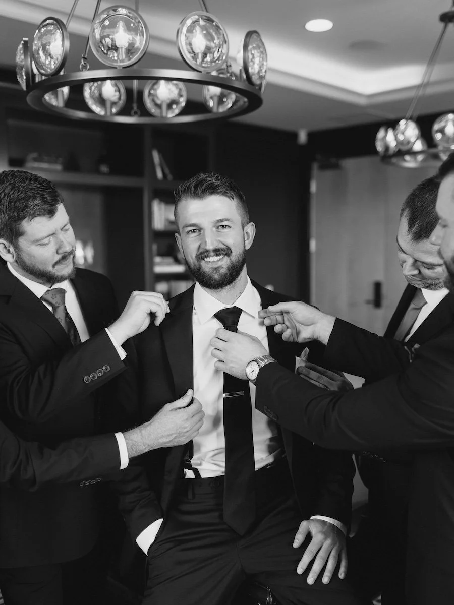 Jeff the groom getting ready fun photos with groomsmen at Delamar West Hartford in Connecticut