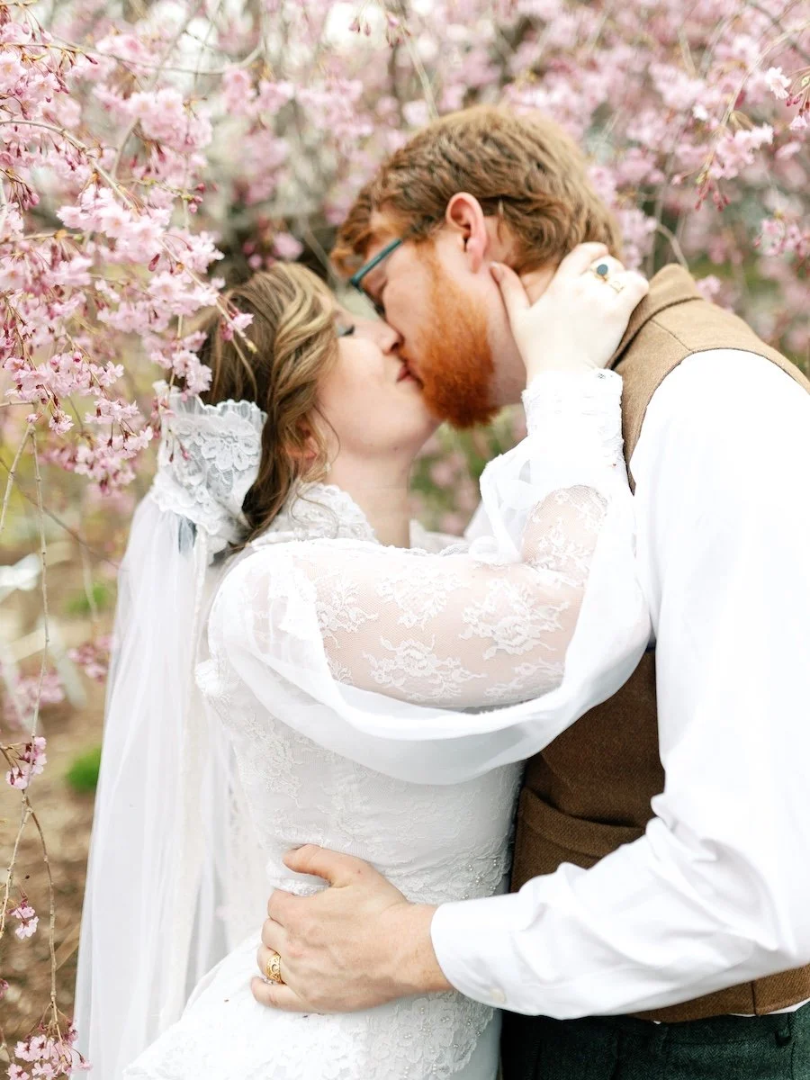 Elegant kiss photo of bride and groom at Pond House Cafe in West Hartford