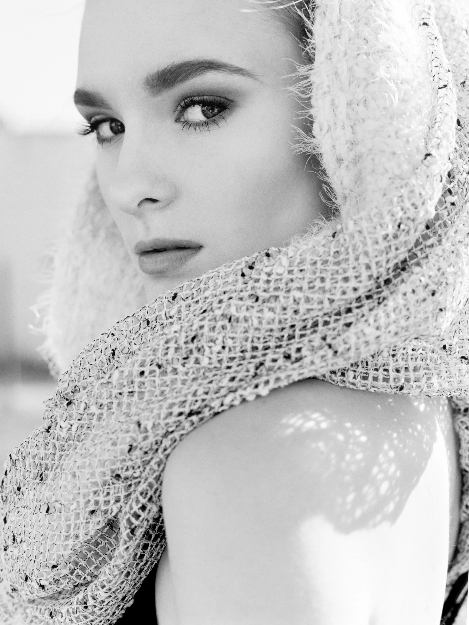woman-looks-over-shoulder-closeup-portrait.jpg