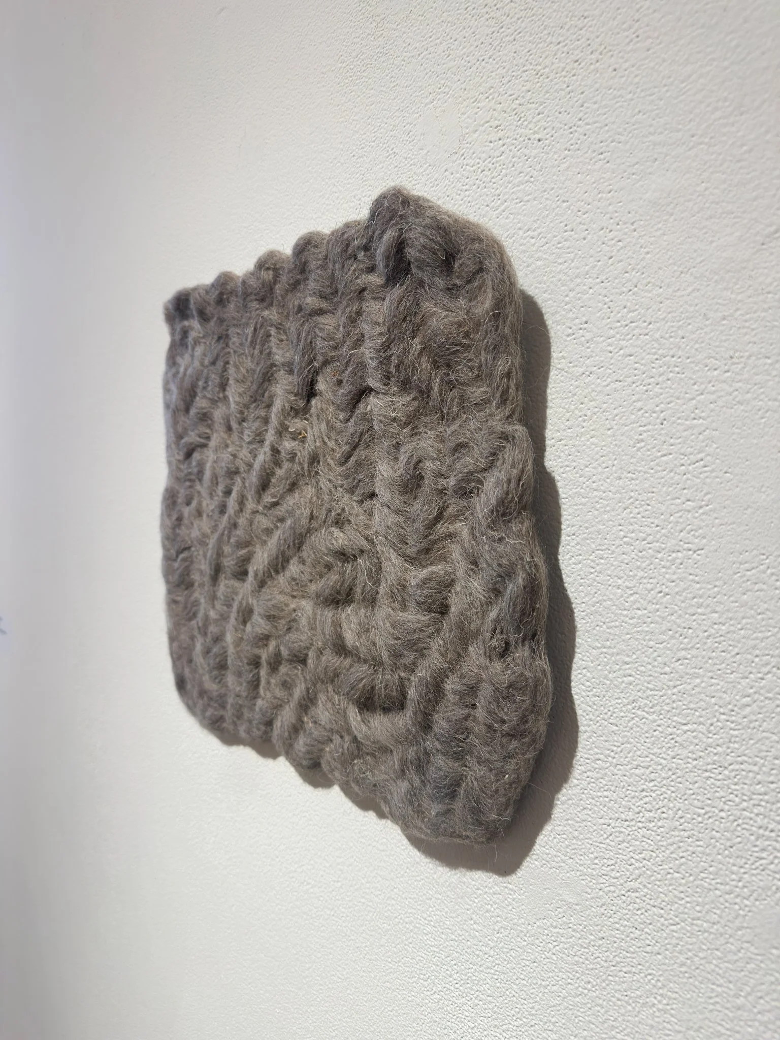 Varied (Gray), 2026, wool felt, 12.5”h x 14”w x 0.5”d