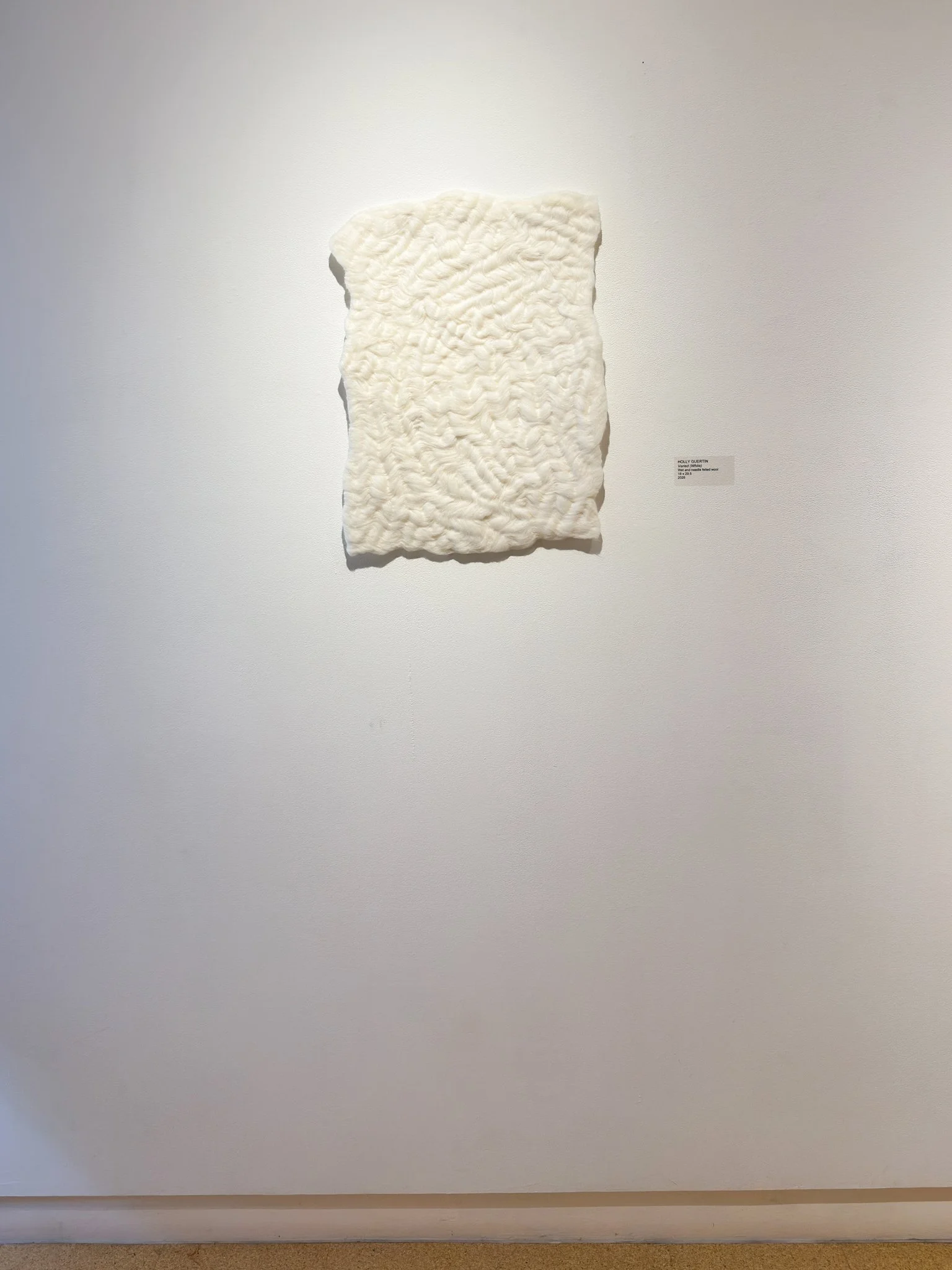 Varied (White), 2026, wool felt, 24.5”h x 18”w x 0.5”d