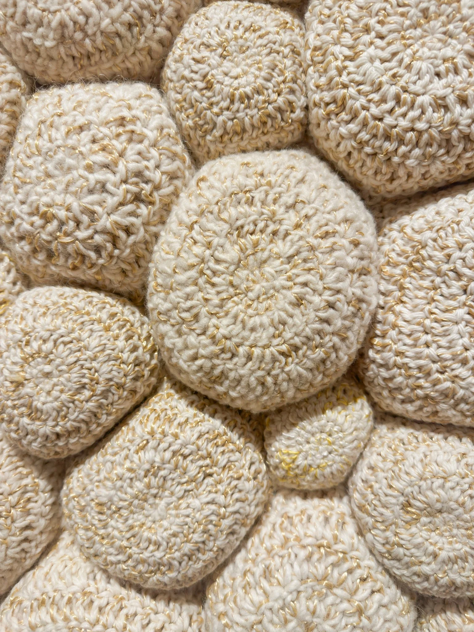 The Intimacy, 2022, crocheted wool yarn, wool fill, reclaimed cotton domestic fabric backing, 28”h x 65”w x 4”d