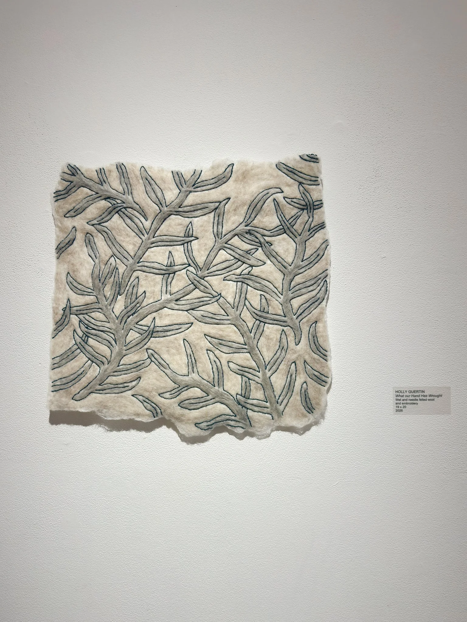 What Your Hand Has Wrought, 2026, wool felt with wool yarn embroidery, 20”h x 19”w x 0.5”d