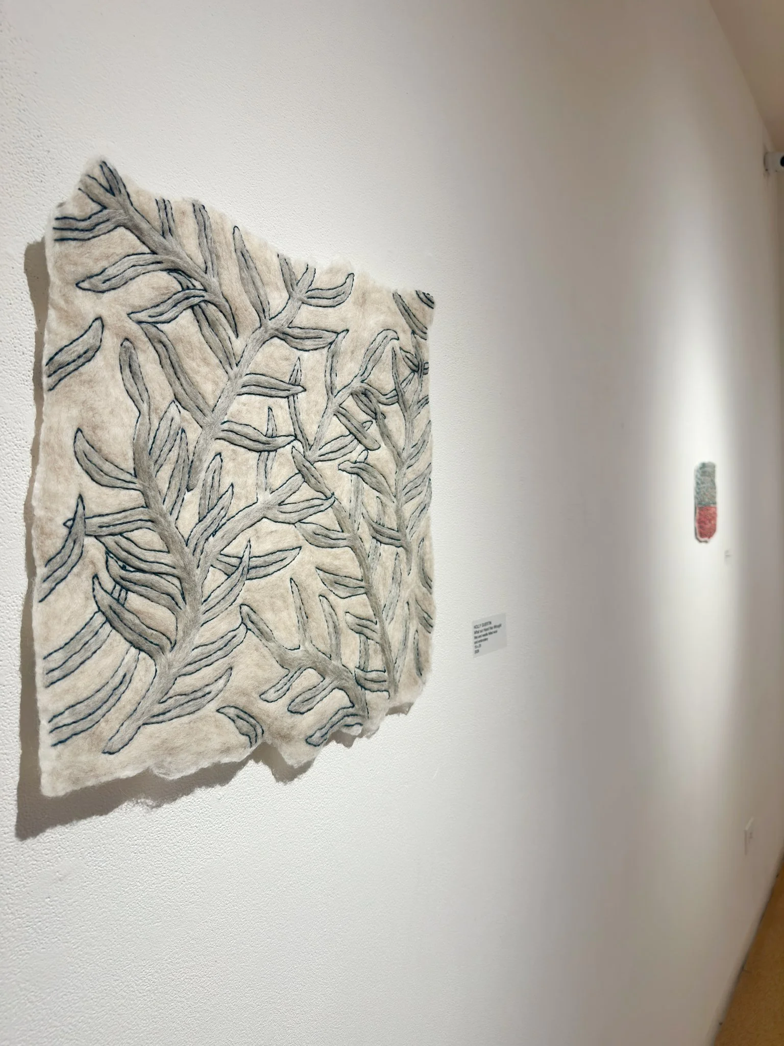 What Your Hand Has Wrought, 2026, wool felt with wool yarn embroidery, 20”h x 19”w x 0.5”d 