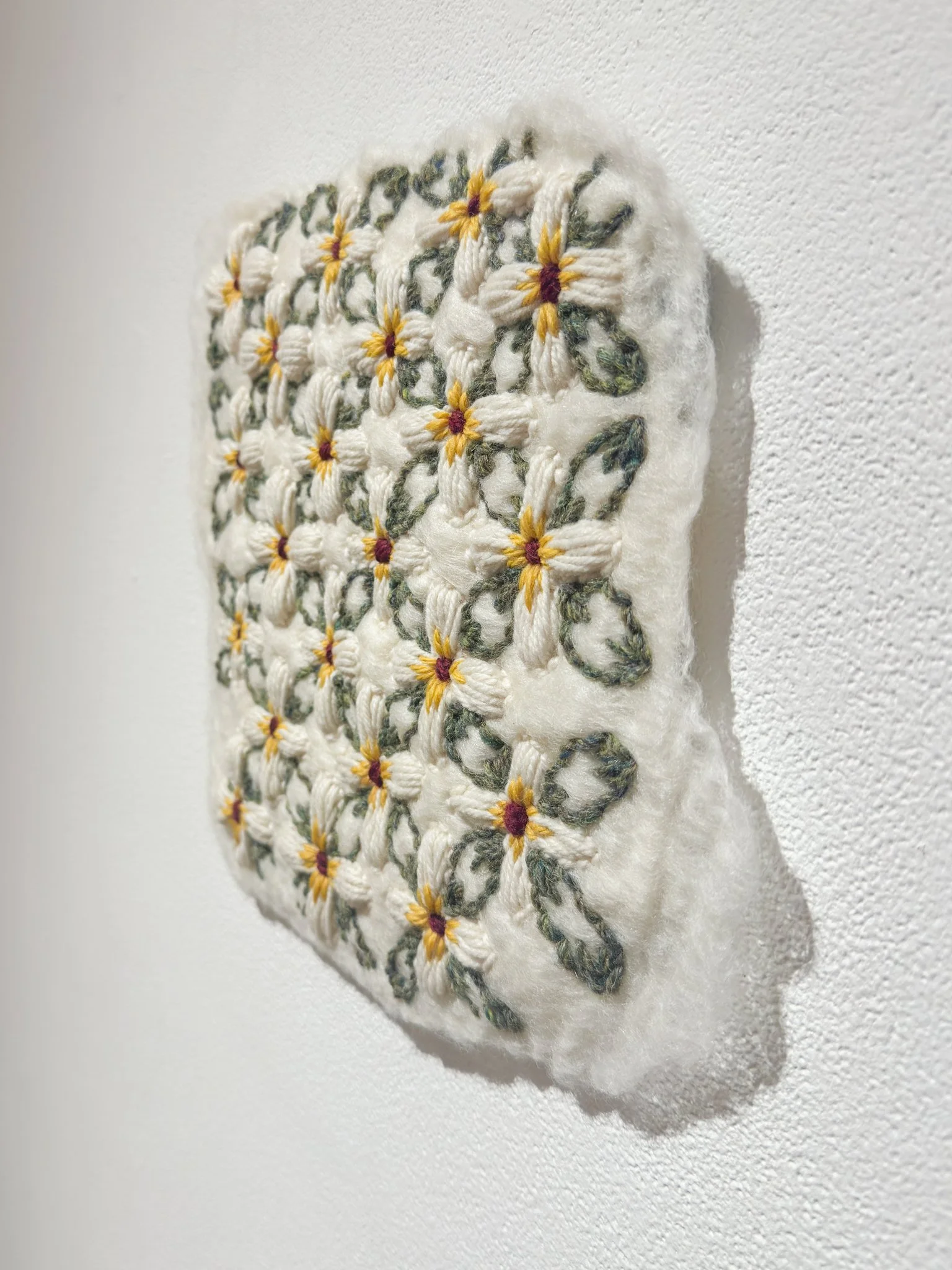 Encore, 2026, wool felt with wool embroidery, 9.5”h x 11”w x 0.25”d