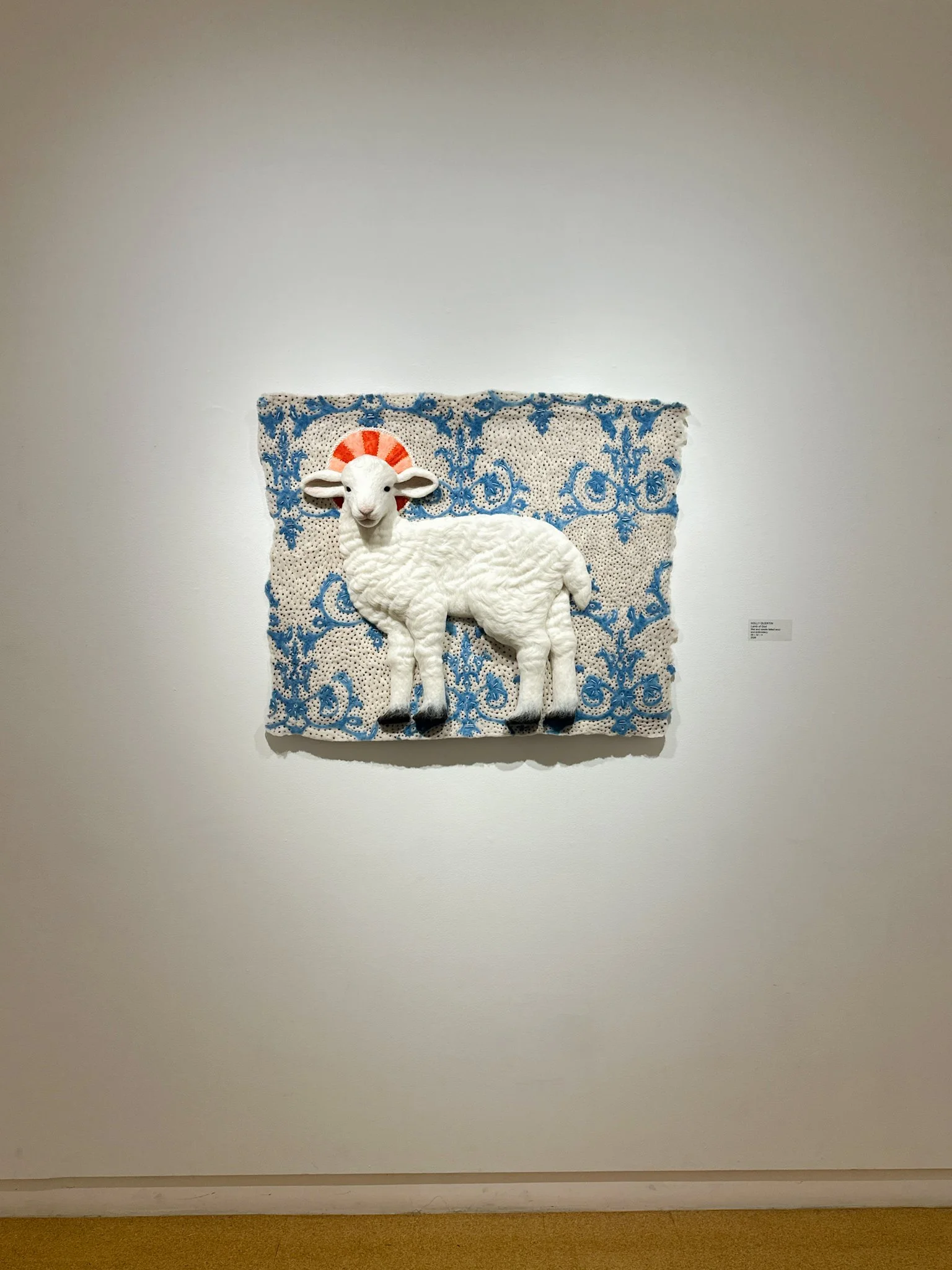 Lamb of God, 2026, wool felt with wool embroidery, 32”h x 39”w x 4”d