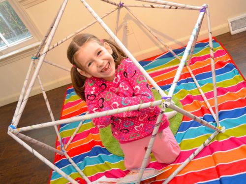This newspaper fort is simply made with rolls of newspaper and tape.