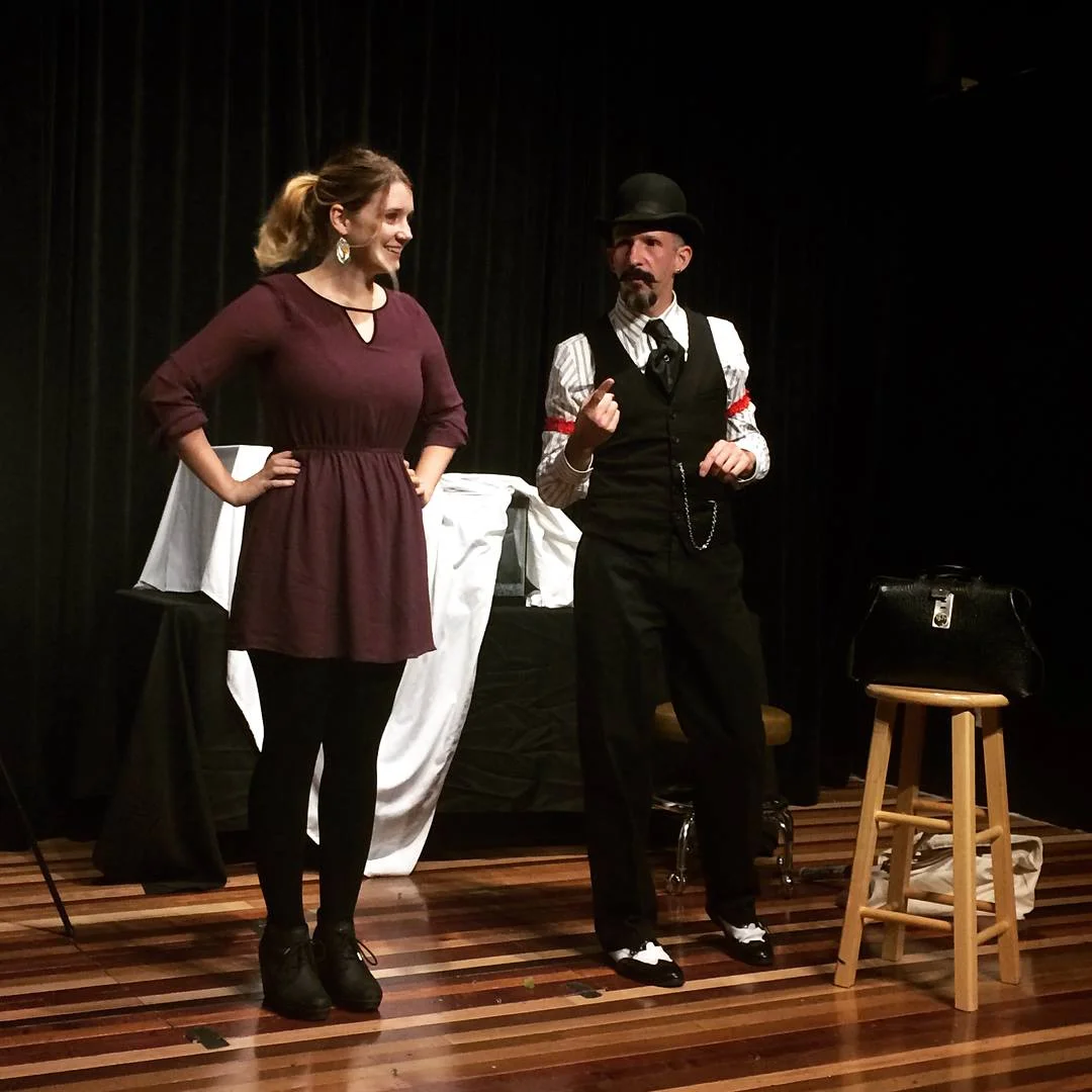 my lovely wife, pulled up on stage to help hammer a nail in this dude's nose! (photo courtesy Juila Kramer)