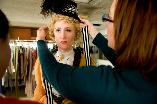 The LEO DUO designers conducting a fitting for a Victorian ensemble.